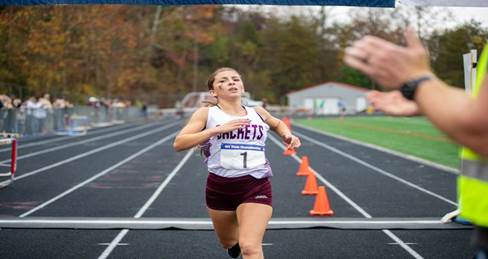 A person running on a track  Description automatically generated